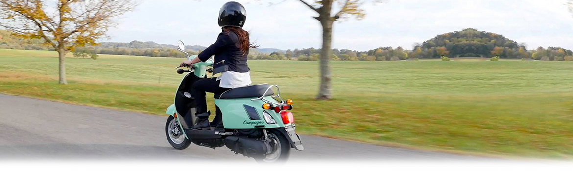 Scooter riding on a back road